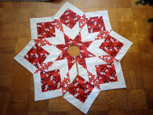 Supreme Accents_Red Poinsettia tree skirt Star 60 inches