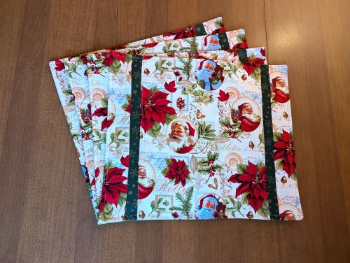 Supreme Accents Classic Santa Placemat Set of 4. Beautiful Santa and poinsettia placemats