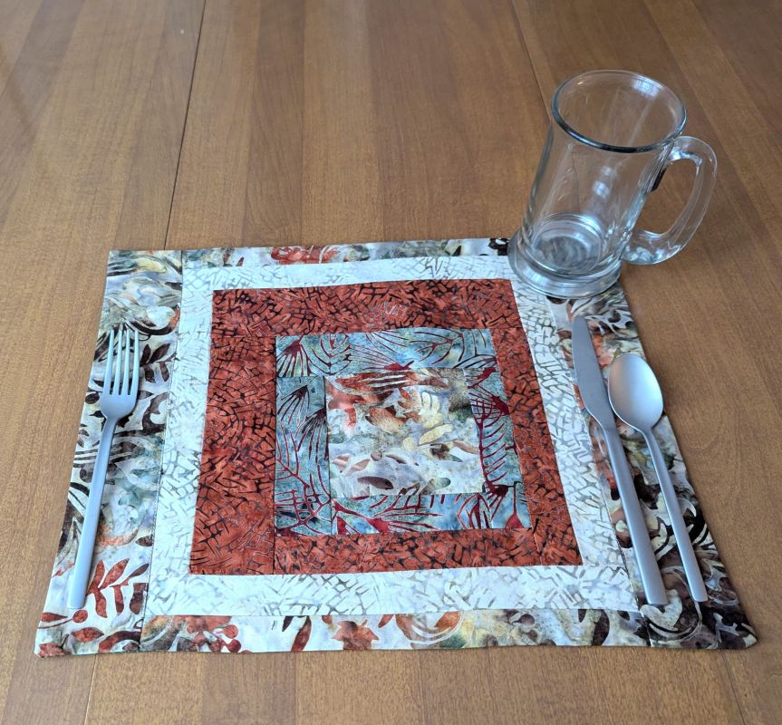 Moss & Rust Batik Placemats,best hand-quilted batik placemats, earth tone dining room decor ideas,Everyday placemats, hand-quilted cotton placemats,handcrafted earth tone batik table linens, handmade batik kitchen table linens,handmade quilted placemats,Handmade table linens,Handmade placemats, modern quilted placemats,patchwork placemats,Quilted placemats,rustic moss green and rust dining runner,placemats for glass table,placemats for kitchen island,Table setting,Unique placemats