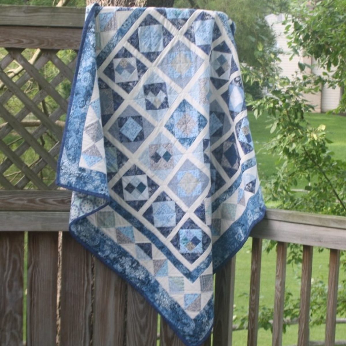 imgi_48_Supreme-Accents-Blue-White-Quilt-Hanging-778x800-768x790